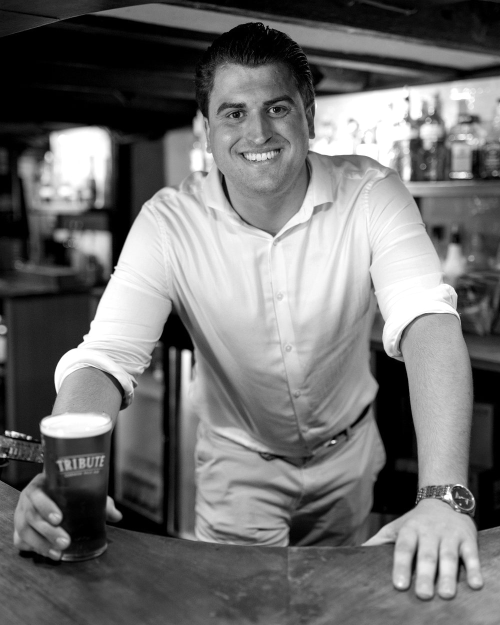 Nick Laws, founder of Hendra One, behind the bar of the pub he runs in Cornwall